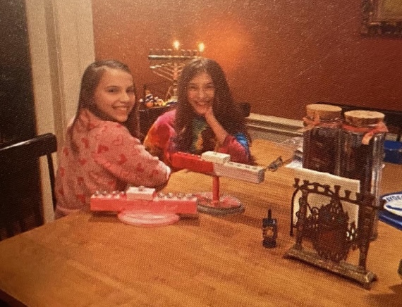 Brooke(right) and Ivy(left) Seligman celebrate Hanukkah in 2015