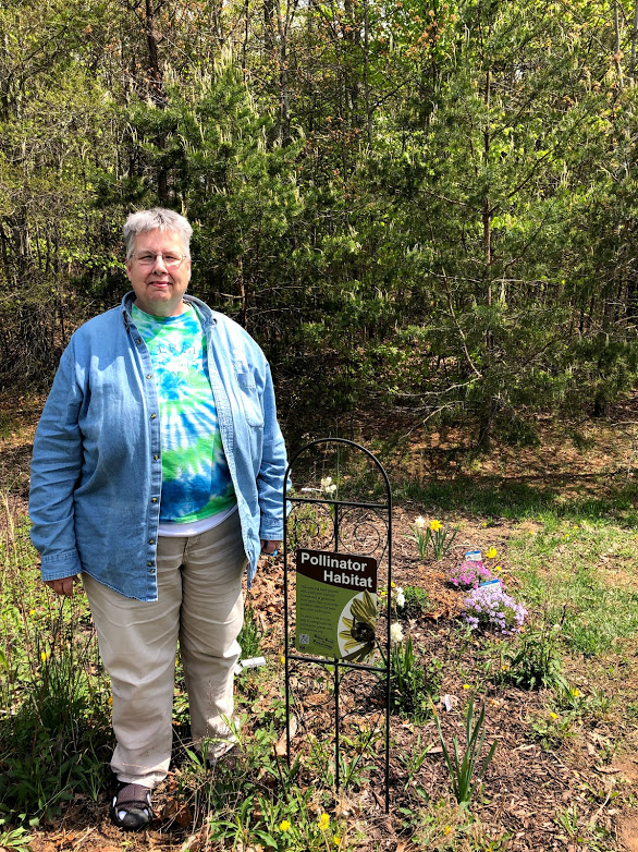 Ms. Way at the pollinator garden run by the schools environmental club